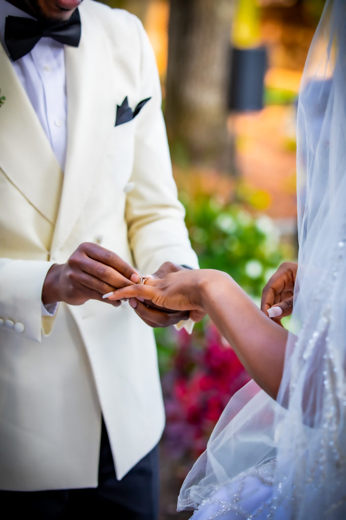 Congolese bride and groom exchange rings during the wedding ceremony at the Radisson hotel in Nashua, NH