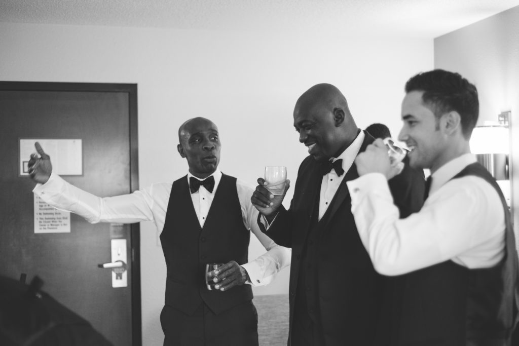 Ivoirian groom and groomsmen drinking before the wedding