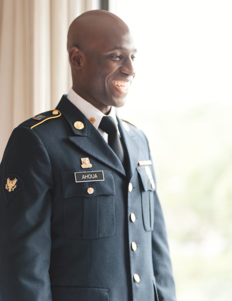 Ivoirian groom smiling before their military wedding