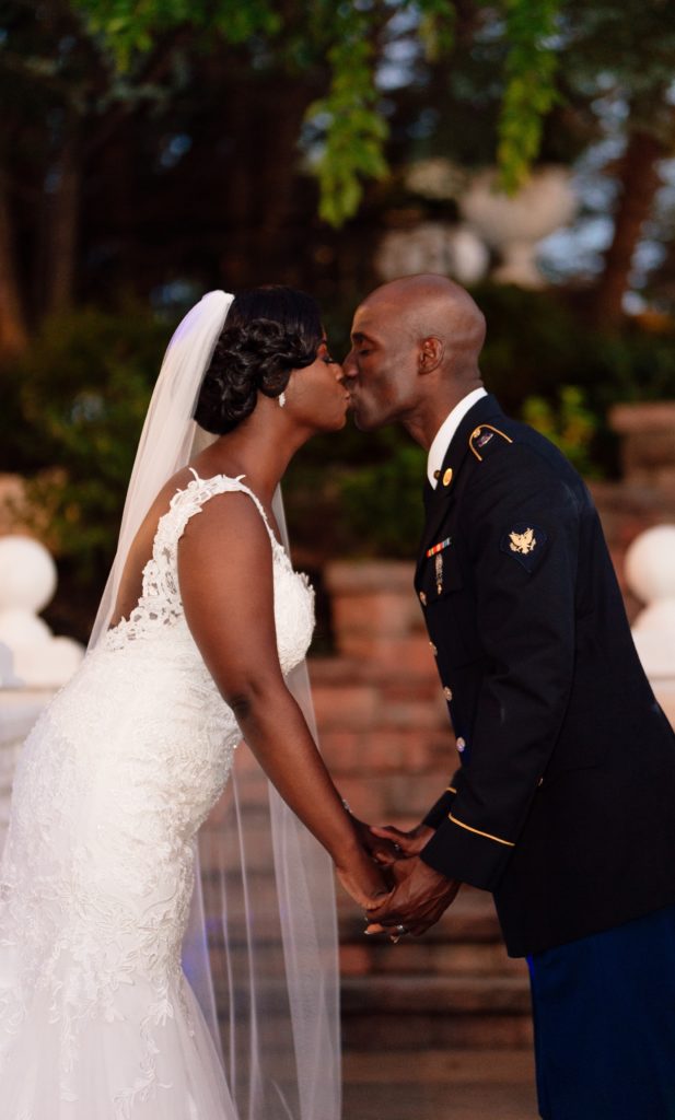 Ivoirian groom and Congolese bride kissing